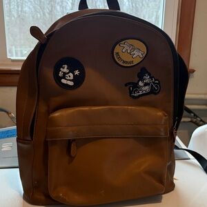 Disney’s Coach Tan Backpack with Mickey Mouse Patches